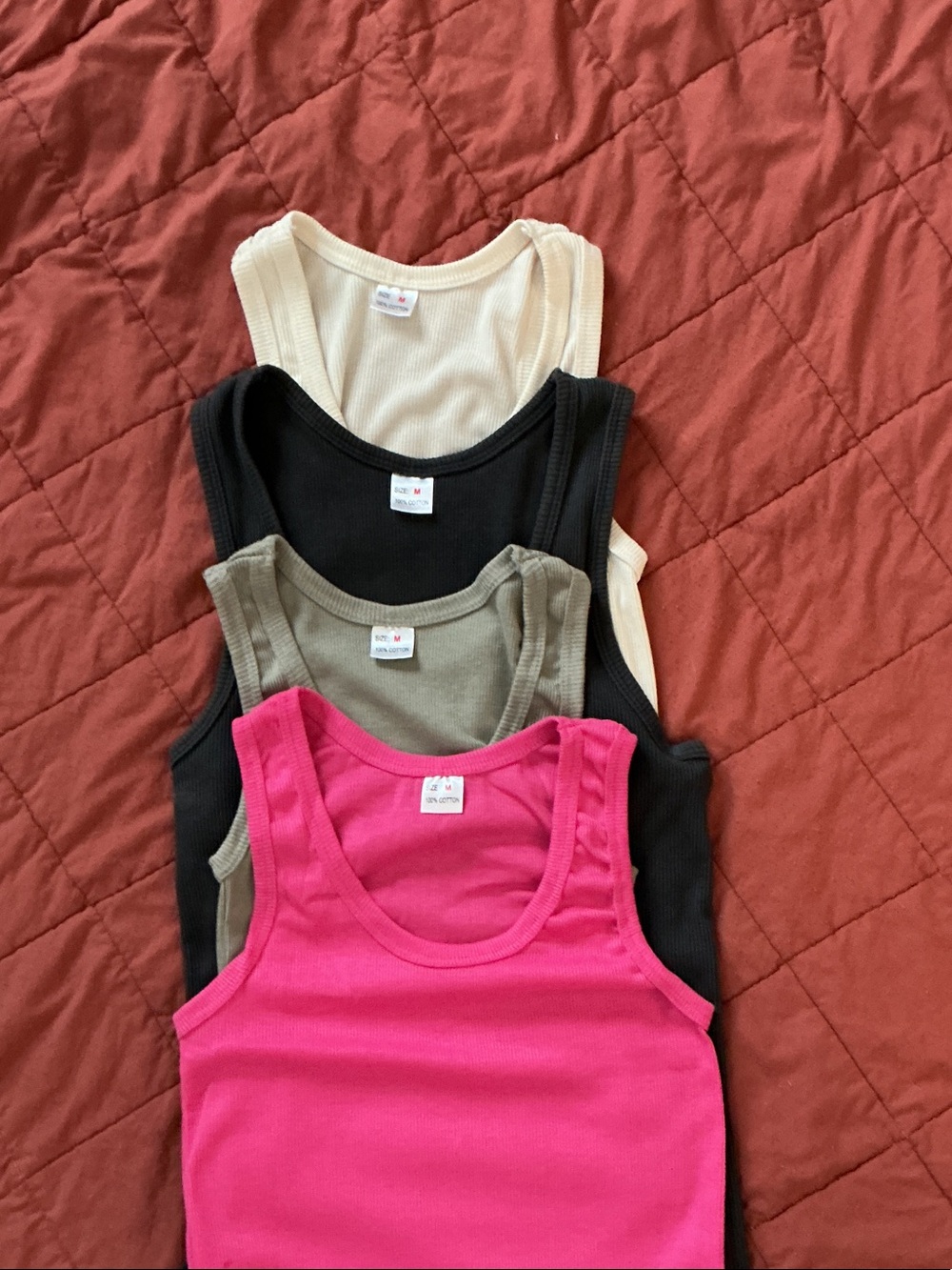 4 tank tops. Size medium but fits small.